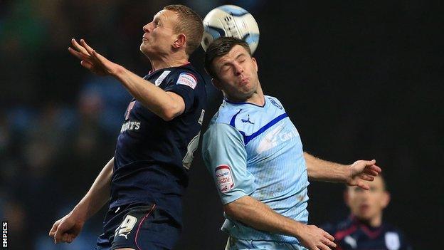 Stuart Beavon (left) challenges Coventry City's Steven Jennings