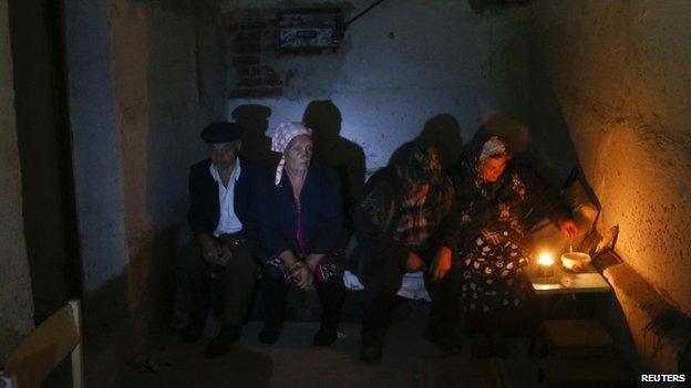 Local residents hide in a basement on the outskirts of Donetsk - 1 September