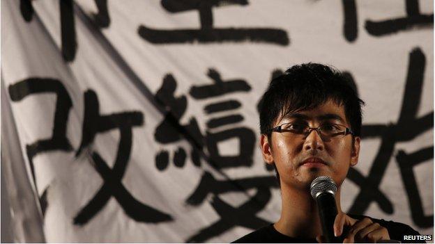 Alex Chow, secretary-general of the Hong Kong Federation of Students, speaks during a campaign to kick off the Occupy Central civil disobedience event in front of the financial Central district in Hong Kong 31 August 2014.