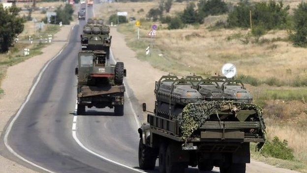 Russian military vehicles drive along the road outside Kamensk-Shakhtinsky, Rostov region, Russia, 16 August 2014