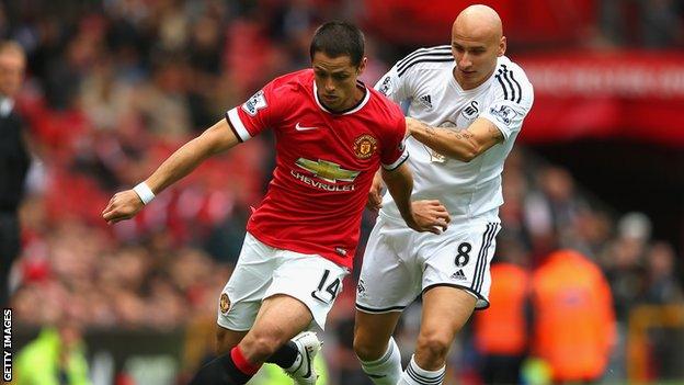 Jonjo Shelvey challenges Javier Hernandez during Swansea's Premier League opening day win at Manchester United