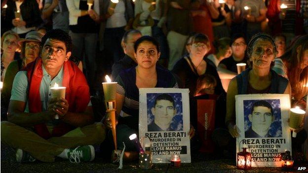 People attend a candlelight vigil in support of asylum seekers, in Sydney on 23 February 2014.