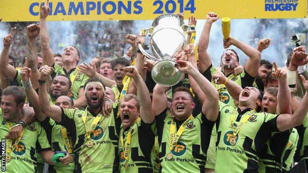 Northampton Saints captain Dylan Hartley and Tom Wood raise the trophy after their victory during the Aviva Premiership Final