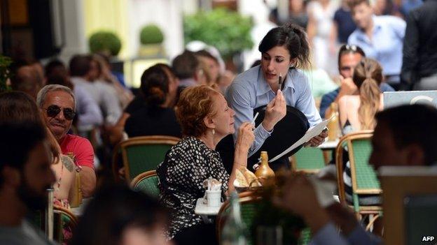 Waitress serving customer