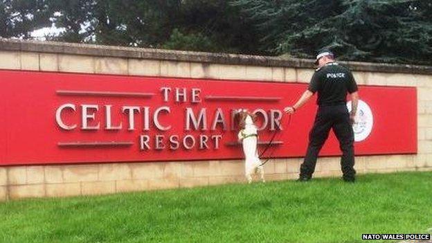 A sniffer dog carries out a search before world leaders arrive