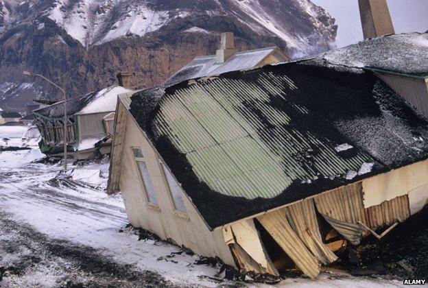 Destruction town following eruption volcano houses moved street by lava flow Eldfell Volcano Heimaey Westmann Isles Iceland 1973