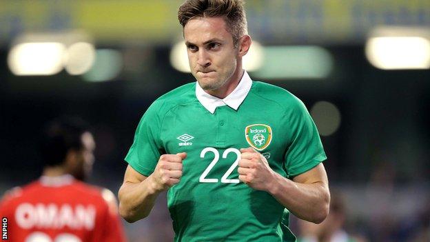 Kevin Doyle celebrates after scoring the opener against Oman