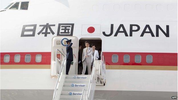 Japanese Prime Minister Shinzo Abe prepares to get off his plane upon his arrival in Port of Spain, Trinidad and Tobago on 27 July 2014.