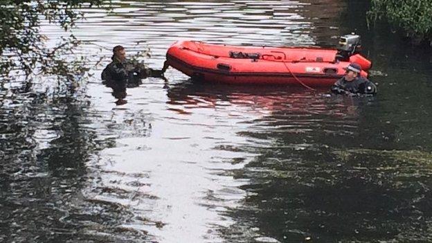 Police diver searching River Brent