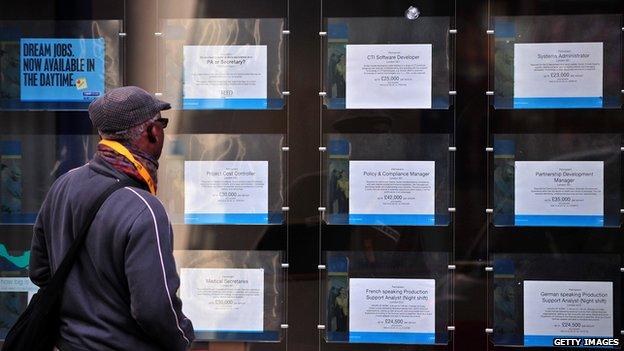 Man looking in JobCentre window