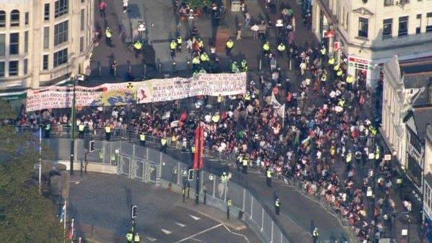 Protesters and onlookers gather near Cardiff Castle on Thursday evening