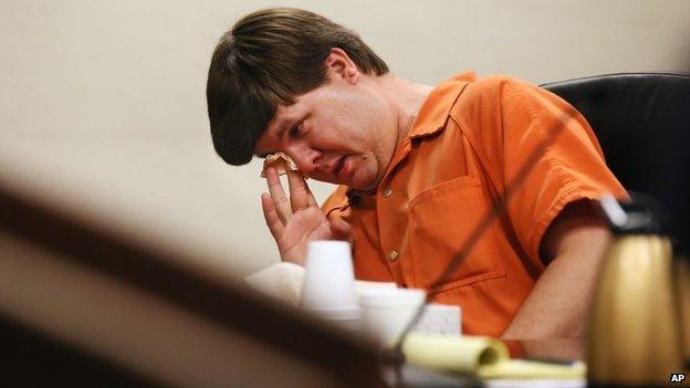 Justin Ross Harris, the father of a toddler who died after police say he was left in a hot car for about seven hours, wipes his eye as he sits during his bond hearing in Cobb County Magistrate Court, 3 July 2014