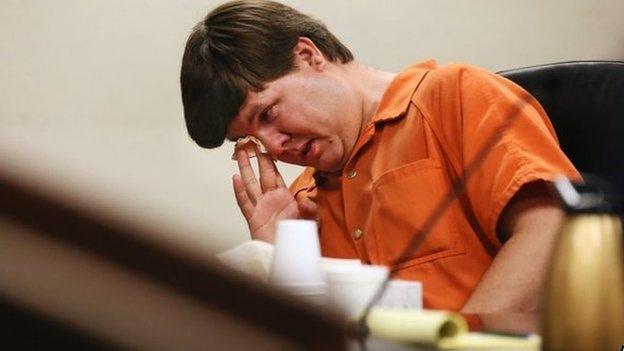 Justin Ross Harris, the father of a toddler who died after police say he was left in a hot car for about seven hours, wipes his eye as he sits during his bond hearing in Cobb County Magistrate Court, 3 July 2014