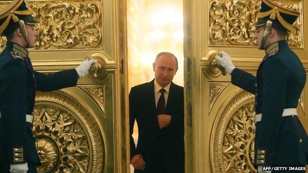 Russian President Vladimir Putin enters the Kremlin's St George Hall in Moscow on 12 December 2013