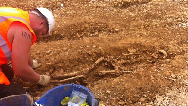 Archaeologist and skeleton, Midland Road Peterborough