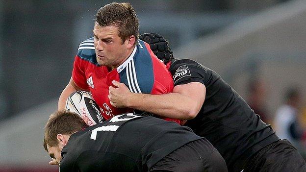 Munster try-scorer CJ Stander is tackled by Greig Tonks and Fraser McKenzie