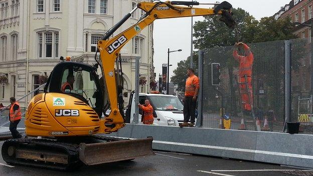 Fences coming down by Westgate Street in Cardiff city centre after Nato Summit