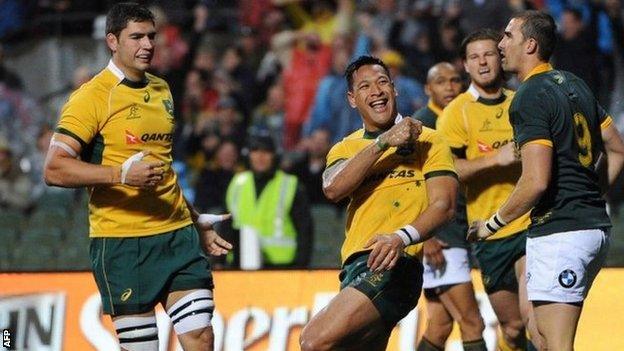 Australia's Israel Folau celebrates scoring