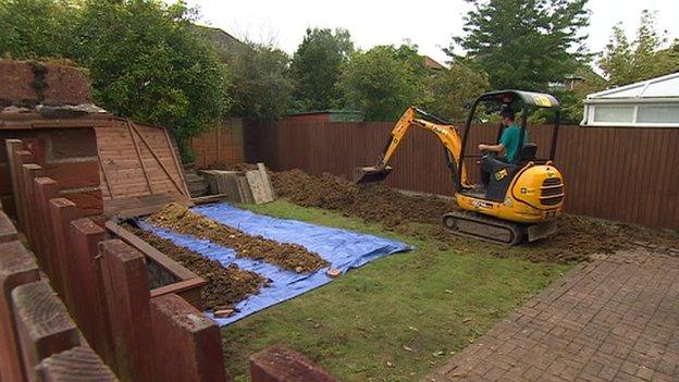 Digger excavates a Cambridgeshire garden in connection with Deborah Steel disappearance