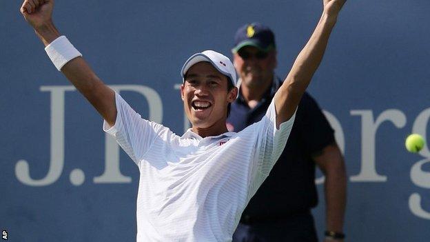 Kei Nishikori, of Japan, reacts after defeating Novak Djokovic