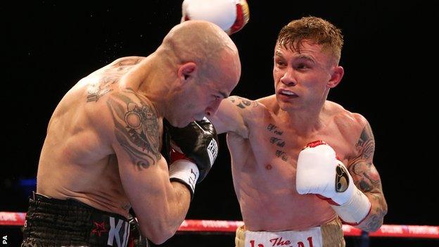 Carl Frampton (right) lands a heavy right-hander on Kiko Martinez