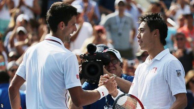 Novak Djokovic congratulates Kei Nishikori