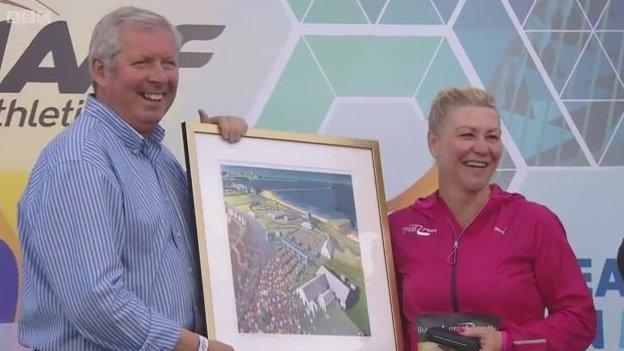 Brendan Foster presenting Tracey Cramond with limited edition print