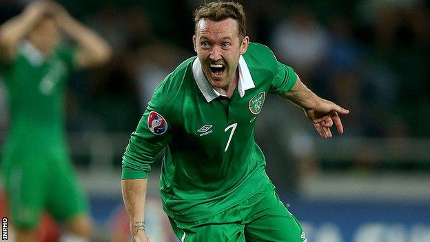 Aiden McGeady turns away in delight after scoring the late winner against Georgia