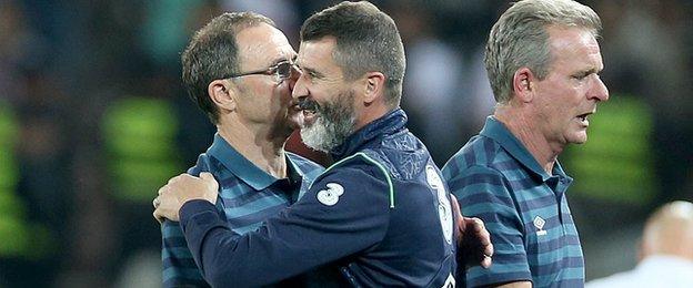 Martin O'Neill is embraced by assistant manager Roy Keane at the final whistle in Tbilisi