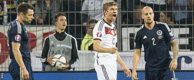 Thomas Muller celebrates after scoring for Germany against Scotland