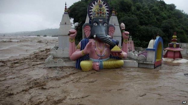 Floodwaters engulf temples in Jammu, India, Saturday, Sept. 6, 2014.