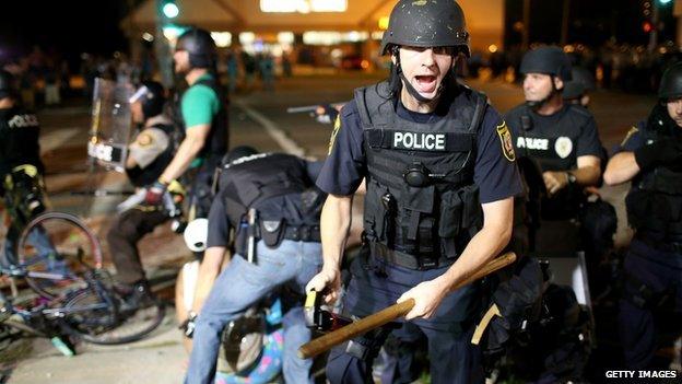 Police arrest a protestor in Ferguson, Missouri, on 18 August, 2014.