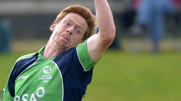 Craig Young is congratulated after taking one of his five wickets against Scotland