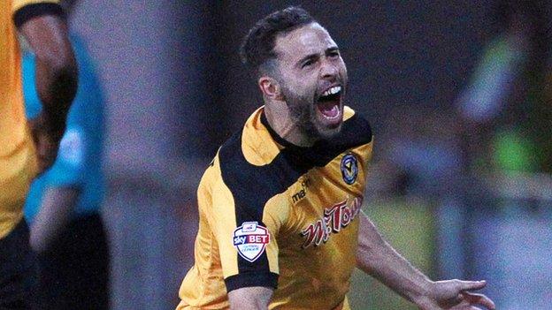 Robbie Willmott celebrates his equaliser against Cambridge