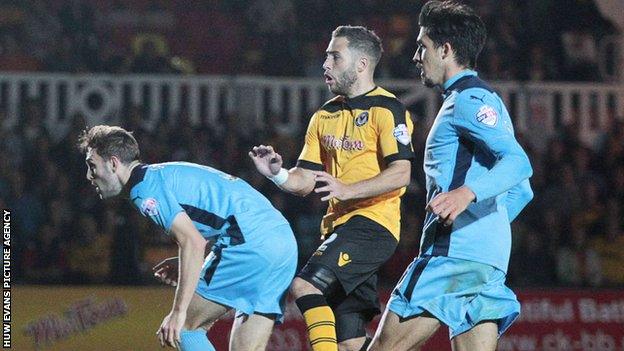 Robbie Willmott scores for Newport against Cambridge