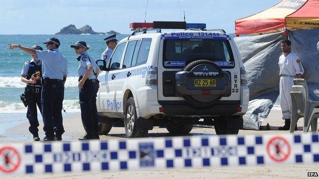 Members of the Australian Police inspect Clarkes Beach at Byron Bay in New South Wales, Australia on 9 September 2014