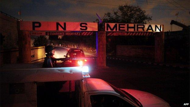 A member of the Pakistani navy stands guard outside the Pakistan's Mehran naval air base in Karachi on 24 May 2011.