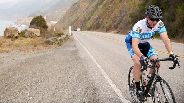 man Road Cycling on a scenic road