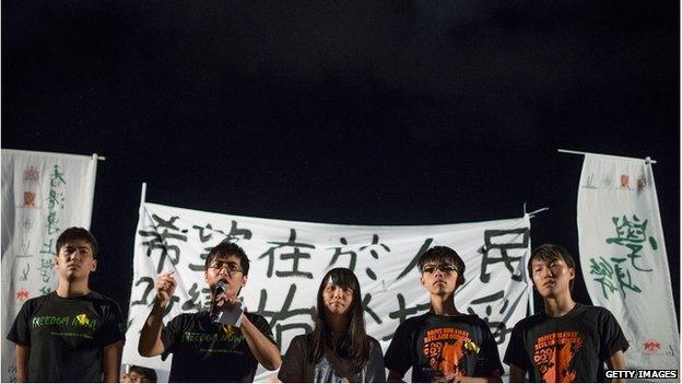 Hong Kong Federation of Students and Scholarism members speak during the protest at Tamar Park outside of the Hong Kong Government Building (31 August 2014)