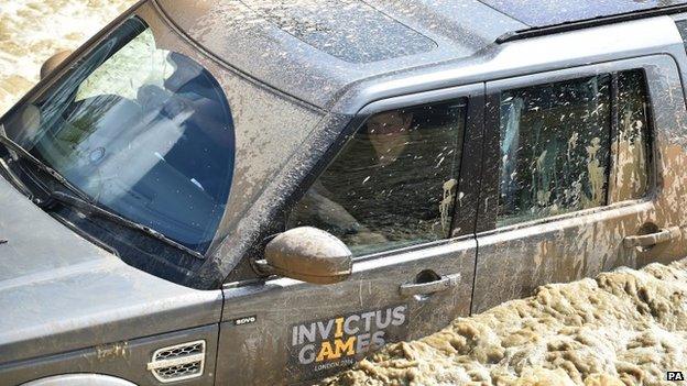 Prince Harry in a Land Rover