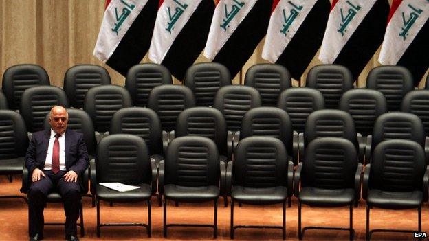 Haider al-Abadi waits for his cabinet at a parliamentary session (8 September 2014)