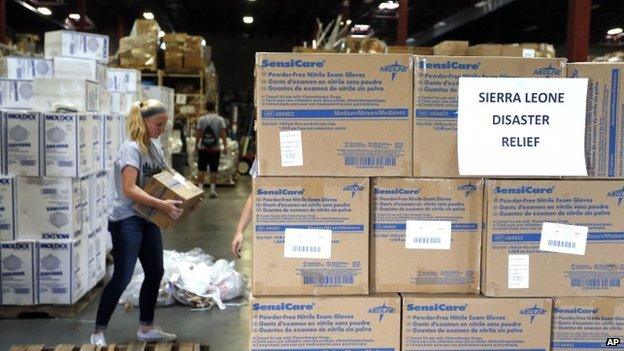 Valor Christian High School sophomore and volunteer Paige Kula loads a pallet with medical supplies bound for Sierra Leone to combat Ebola, inside a warehouse in Centennial, Colorado on 9 September 2014.