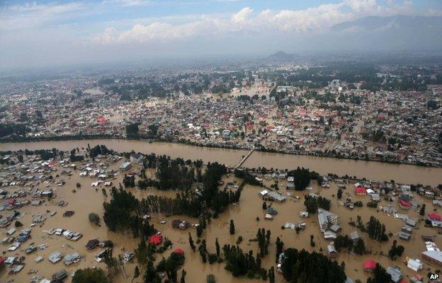 An aerial view shows buildings submerged in floodwaters in Srinagar, in Indian Kashmir, Tuesday, Sept. 9, 2014