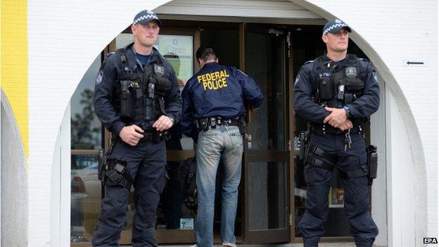 Australian Federal Police stands outside the iQraa Islamic Centre in Underwood, a suburb of Brisbane, Australia, 10 September 2014.