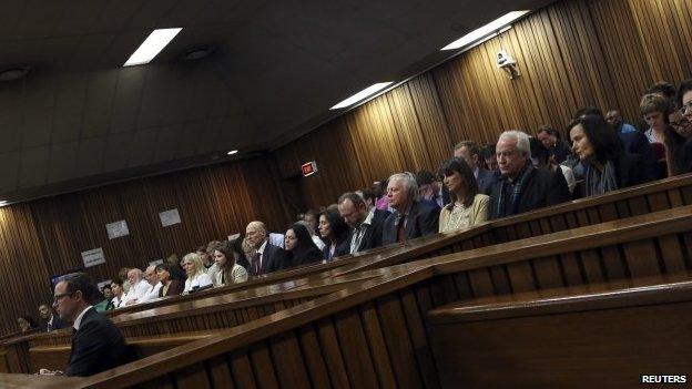 South African Olympic and Paralympic sprinter Oscar Pistorius sits in the dock before the defence's final argument in the North Gauteng High Court in Pretoria (8 August 2014)