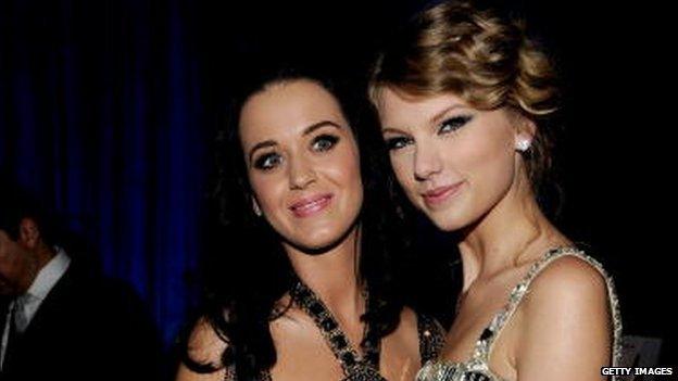 Katy and Taylor smiling for a photo together