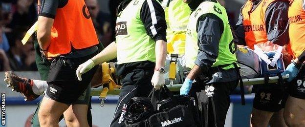 Tom Croft being taken off on a stretcher against Harlequins in 2012