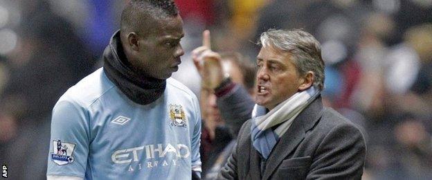 Mario Balotelli (left) and Roberto Mancini