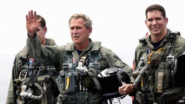 Bush declares "mission accomplished" on the desk of a US aircraft carrier