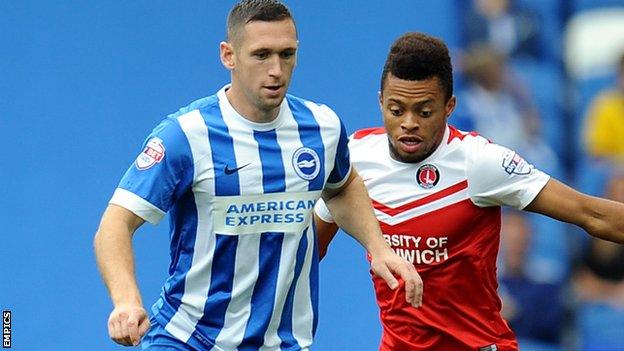 Brighton's Andrew Crofts and Charlton's Jordan Cousins